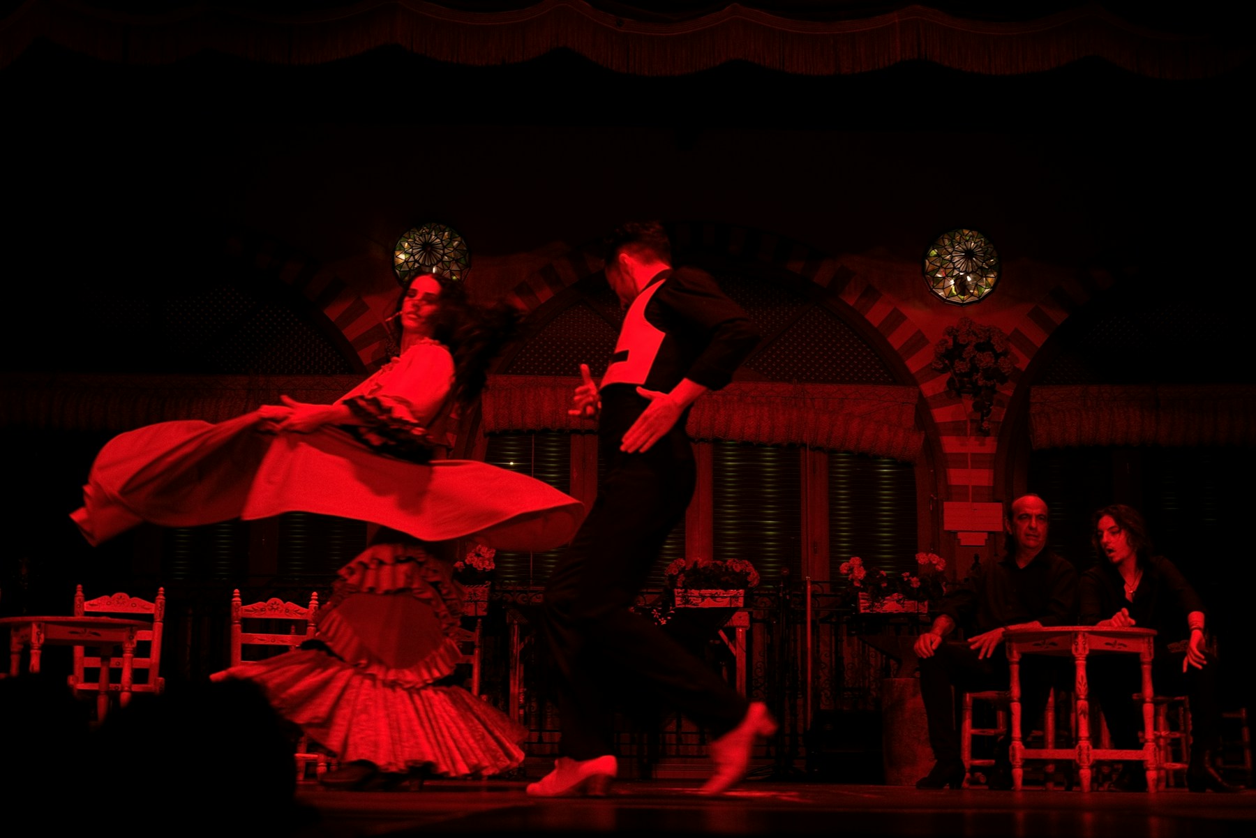 Performance image for Safdarjung Jazz Club — a dance duet performing under red stage lights